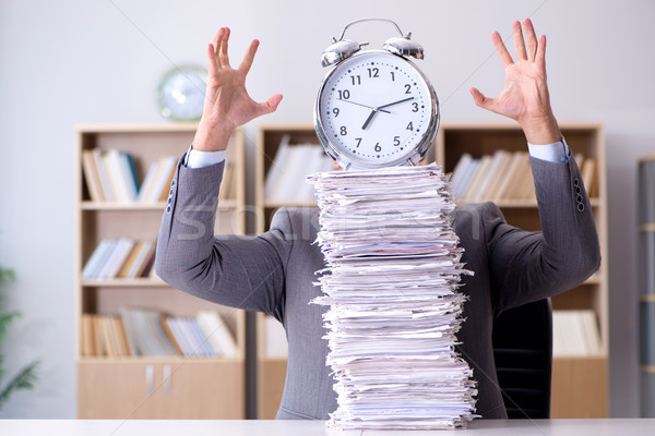 Businessman struggling to meet challenging deadlines Stock photo © Elnur