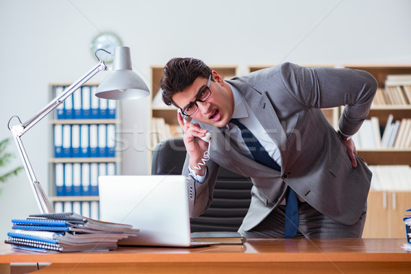 Businessman feeling pain in the office Stock photo © Elnur