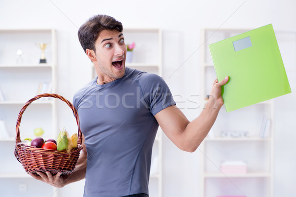 Man promoting the benefits of healthy eating and doing sports Stock photo © Elnur