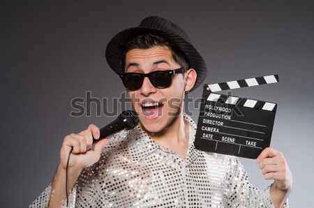 Woman with movie clapper on white Stock photo © Elnur