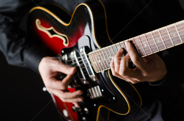 Man with guitar during concert Stock photo © Elnur