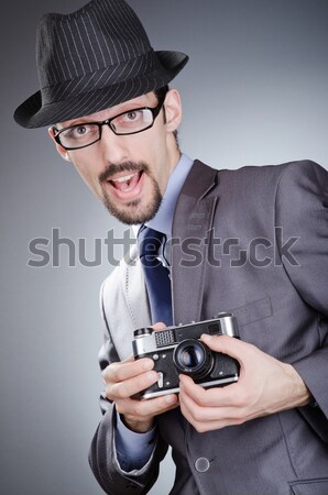 [[stock_photo]]: Jeune · homme · élégante · costume · arme · de · poing · gris