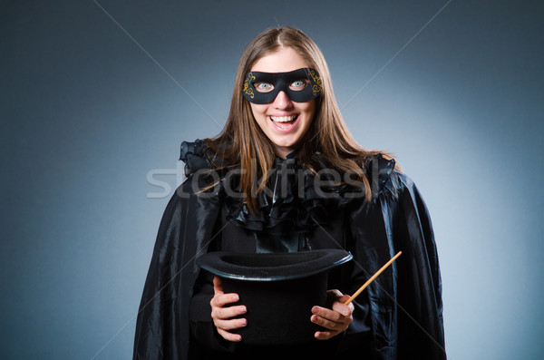 Woman magician in funny concept Stock photo © Elnur