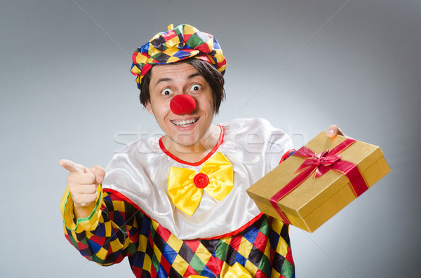 Clown with giftbox in funny concept Stock photo © Elnur