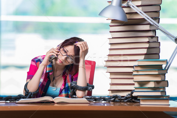 Stock photo: Young female student preparing for exams