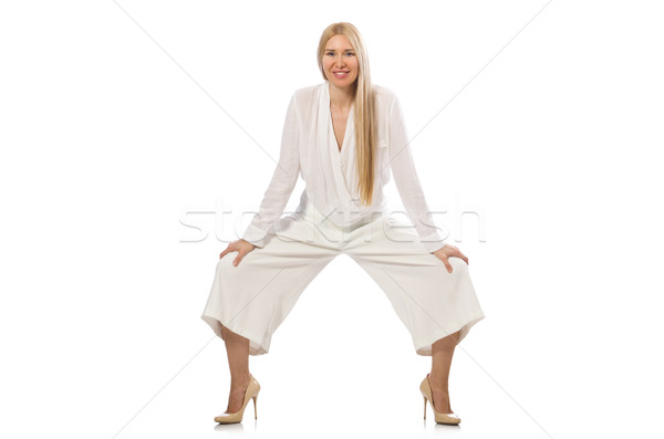 Blond hair model in elegant flared pants isolated on white Stock photo © Elnur