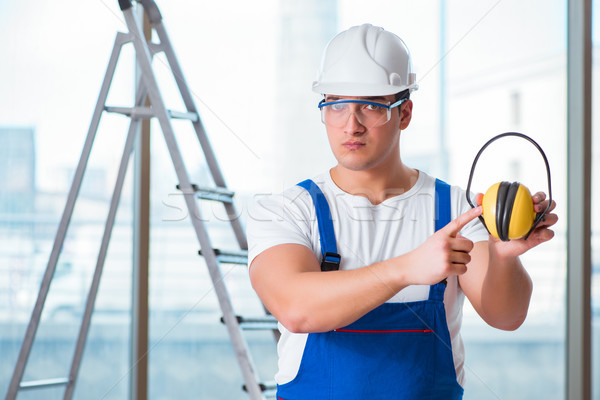 Young worker with noise cancelling headphones Stock photo © Elnur