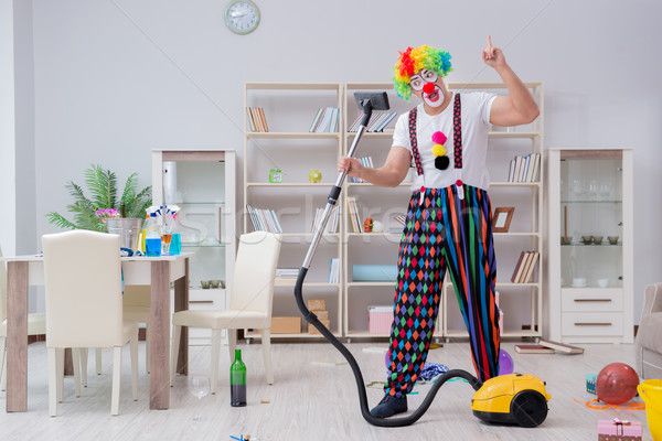 Funny clown doing cleaning at home Stock photo © Elnur