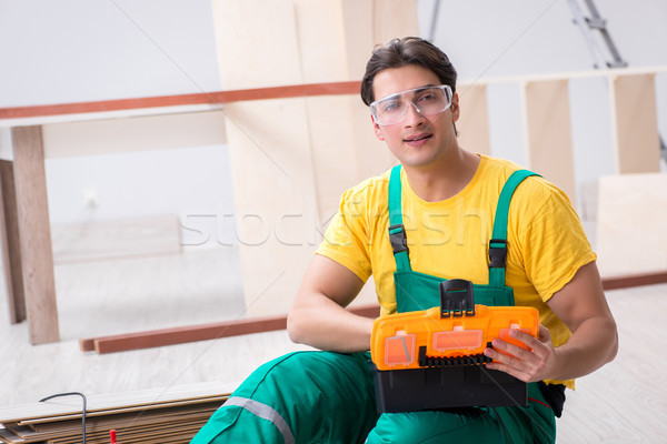 Contractor working on laminate wooden floor  Stock photo © Elnur