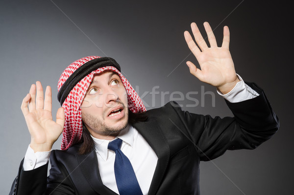 Arab businessman againt grey background Stock photo © Elnur