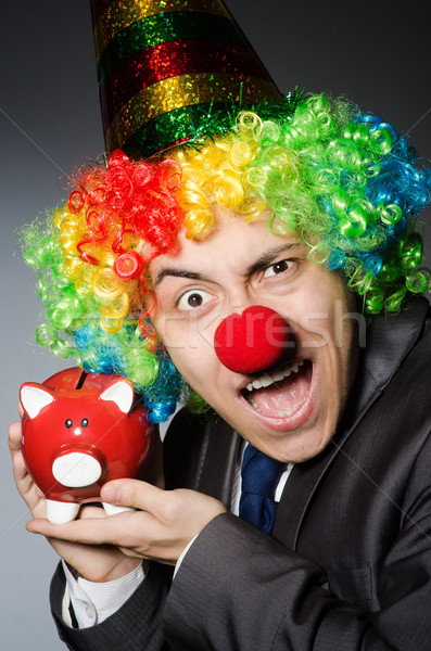Clown with piggybank in funny concept Stock photo © Elnur