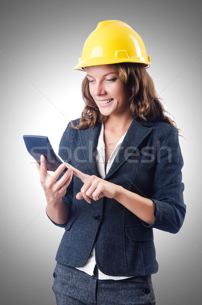 Female builder with calculator on white Stock photo © Elnur