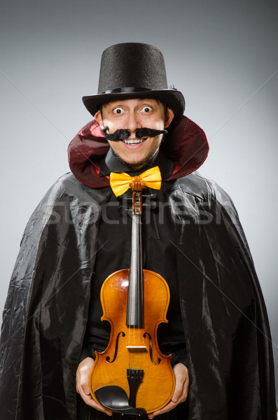 Funny violin player wearing tophat Stock photo © Elnur