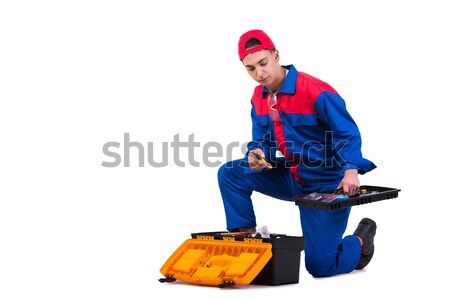 Young repairman with silicone gun isolated on white Stock photo © Elnur