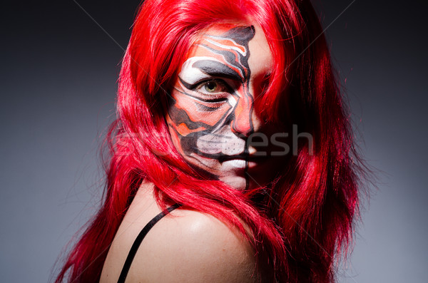 Woman with tiger face in halloween concept Stock photo © Elnur