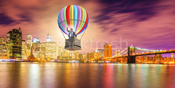 Businessman flying on balloon in challenge concept Stock photo © Elnur