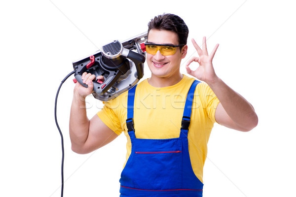 Carpenter wearing coveralls with circular saw isolated on white Stock photo © Elnur