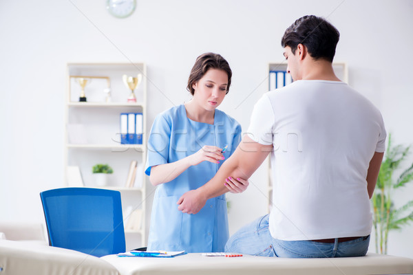 Man visiting female doctor in medical concept Stock photo © Elnur