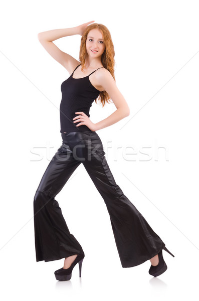 Redhead woman in black bell bottom pants on white Stock photo © Elnur