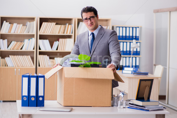 The man moving office with box and his belongings Stock photo © Elnur