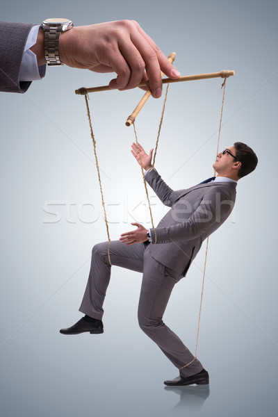 Businessman puppet being manipulated by boss Stock photo © Elnur