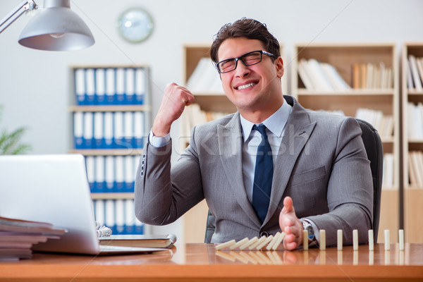 The businessman with dominoes in the office Stock photo © Elnur