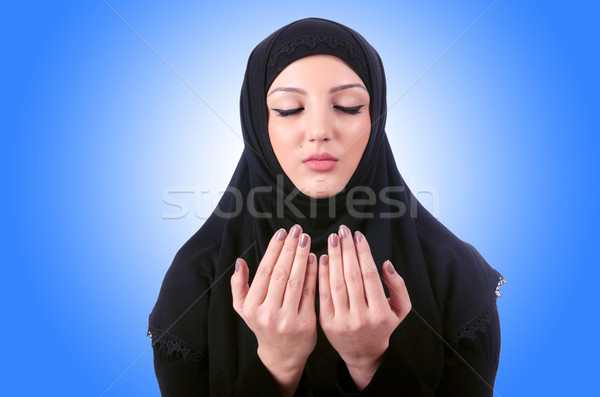 Stock photo: Muslim young woman wearing hijab on white