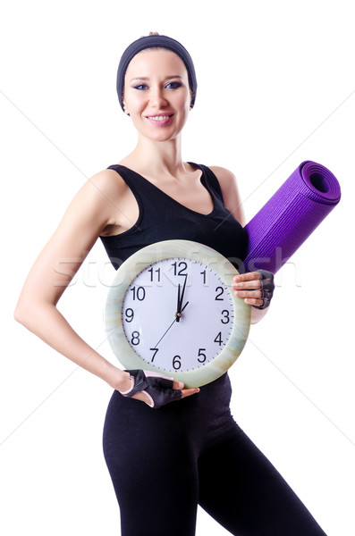 Female sportsman holding rug and clock isolated on white Stock photo © Elnur