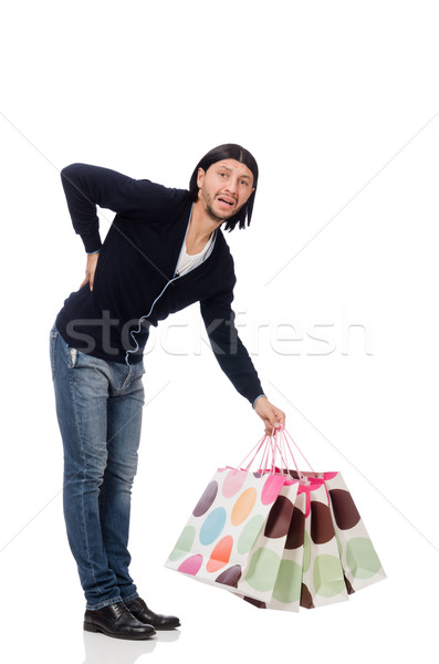 Young man holding plastic bags isolated on white Stock photo © Elnur