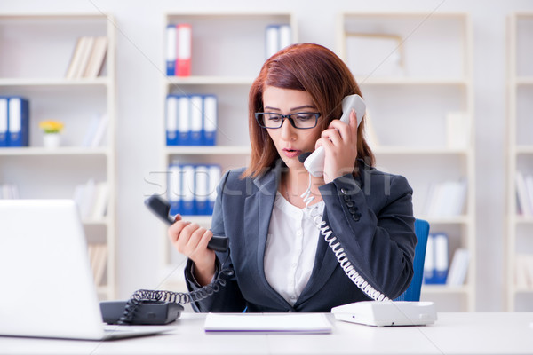 Frustrated call center assistant responding to calls Stock photo © Elnur