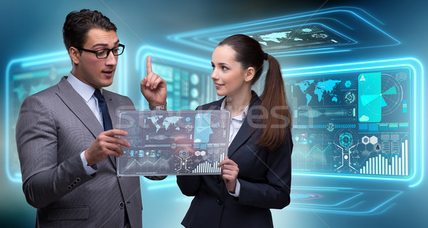 Pair of businessman and businesswoman discussing data Stock photo © Elnur