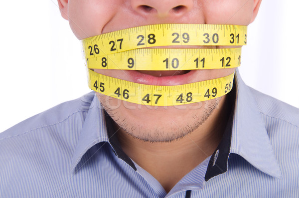 Man with centimeter in dieting concept Stock photo © Elnur