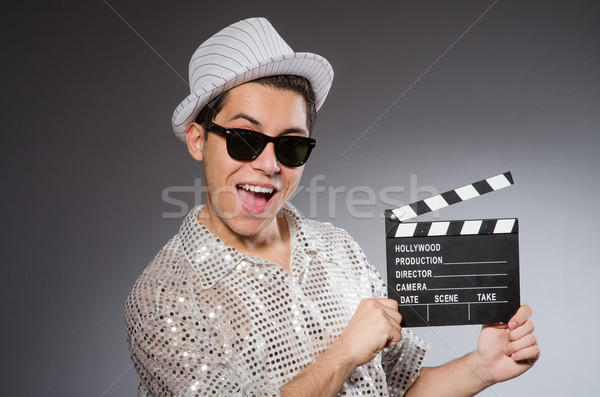 Young camera assistant with clapperboard Stock photo © Elnur