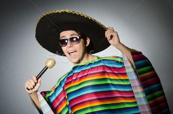 Stock photo: Funny mexican singing in karaoke