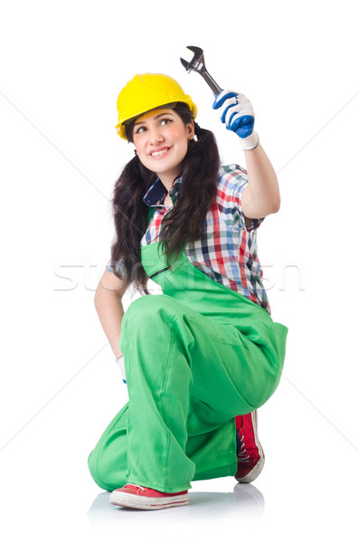 Female workman in green overalls holding key isolated on white Stock photo © Elnur