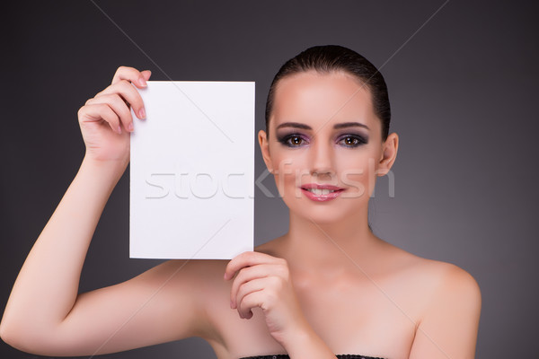 The beautiful woman with blank message paper Stock photo © Elnur