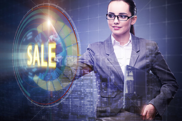 Businesswoman pressing buttons in sale concept Stock photo © Elnur