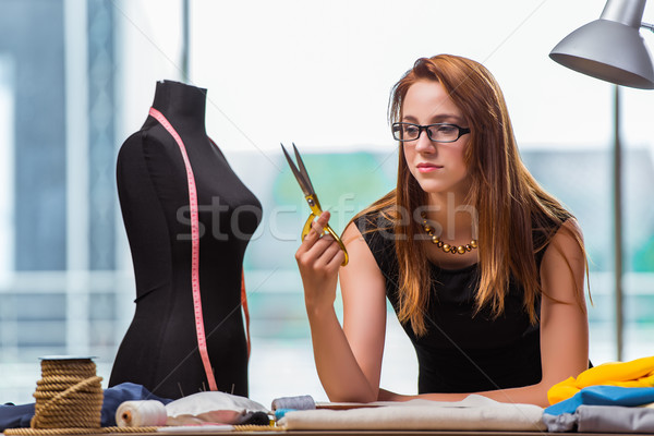 The woman tailor working on new clothing Stock photo © Elnur