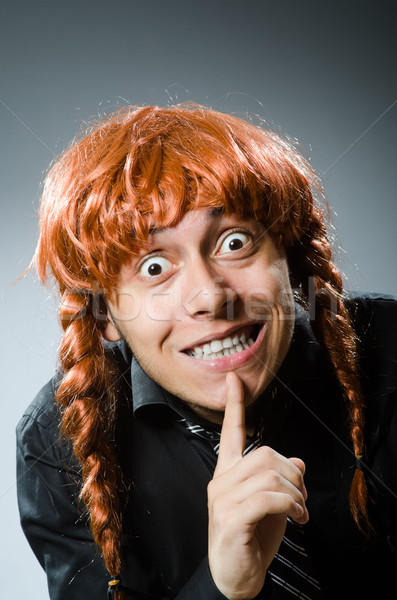 Funny man with red hair wig Stock photo © Elnur