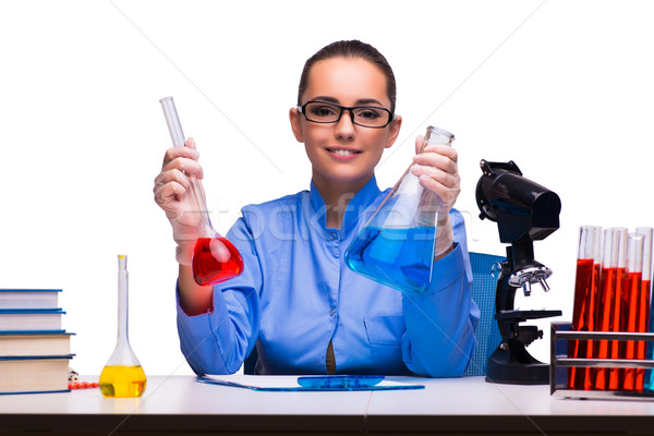 Stock photo: Young female doctor in lab isolated on white