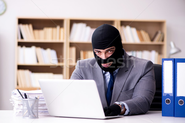 The criminal businessman wearing balaclava in office Stock photo © Elnur