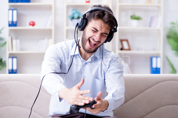 Student gamer playing games at home Stock photo © Elnur