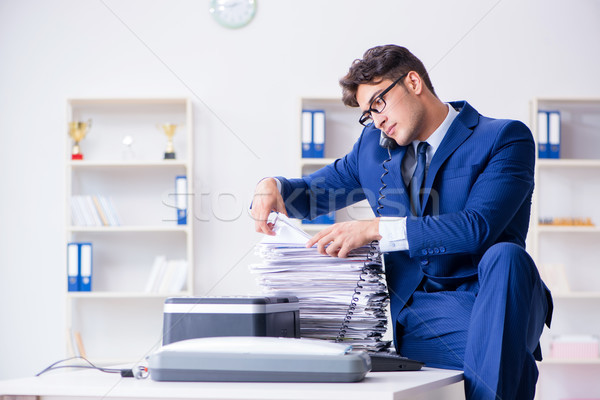 Businessman making copies in copying machine Stock photo © Elnur