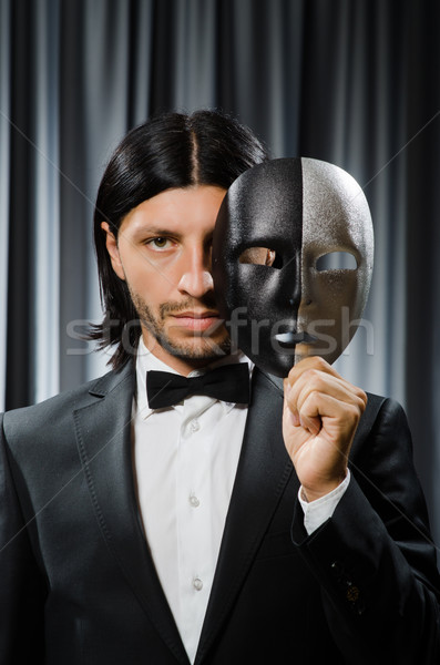 Stock photo: Funny concept with theatrical mask