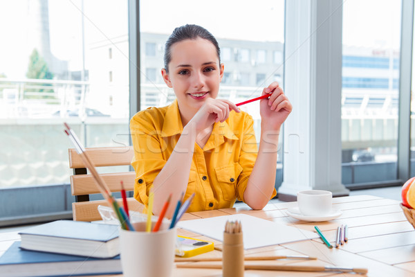 Young school gilr drawing pictures at home Stock photo © Elnur