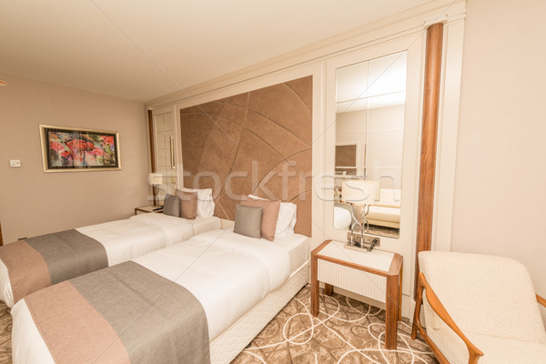 Modern hotel room with big bed Stock photo © Elnur