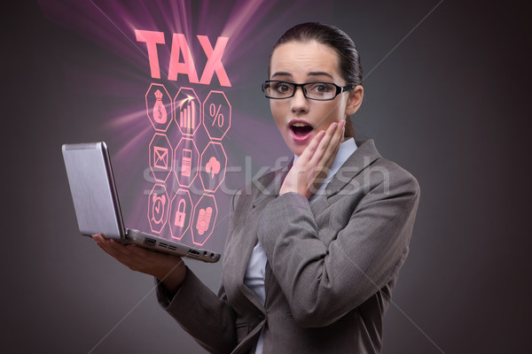 Businesswoman in business tax concept Stock photo © Elnur