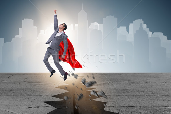 Superhero businessman escaping from difficult situation Stock photo © Elnur