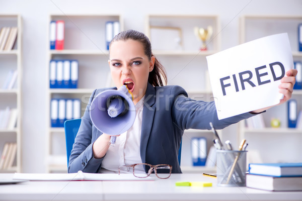 Angry businesswoman issuing termination notice Stock photo © Elnur