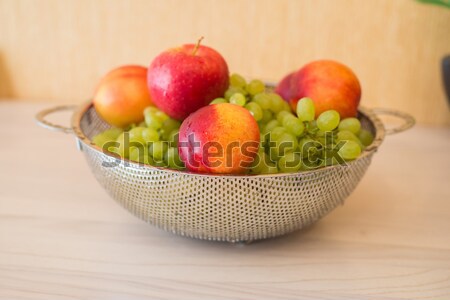 Fruits in the bown on table Stock photo © Elnur